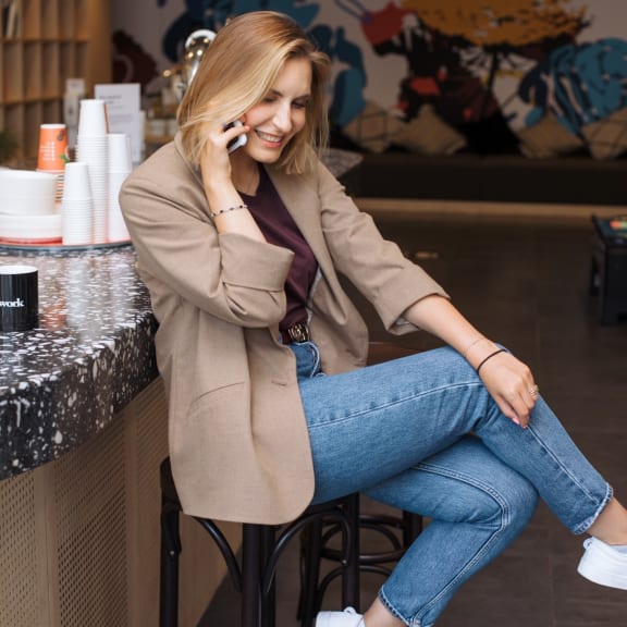 Woman Talking on Phone and Smiling