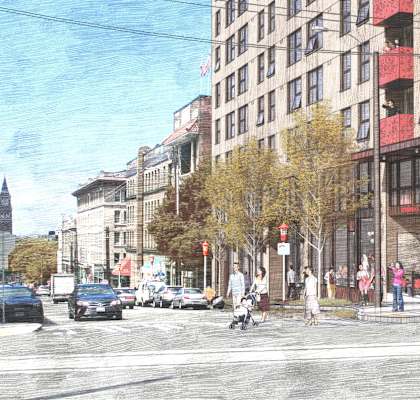 A street scene with a person walking on the sidewalk.