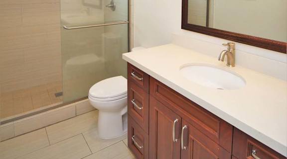a bathroom with a sink toilet and a shower