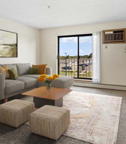 the living room of an apartment with a couch and a table