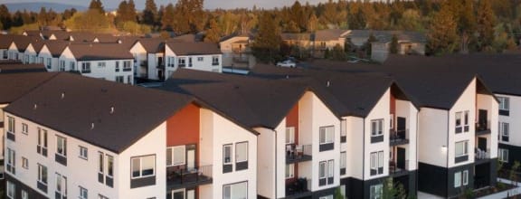 an aerial view of a row of houses at dusk