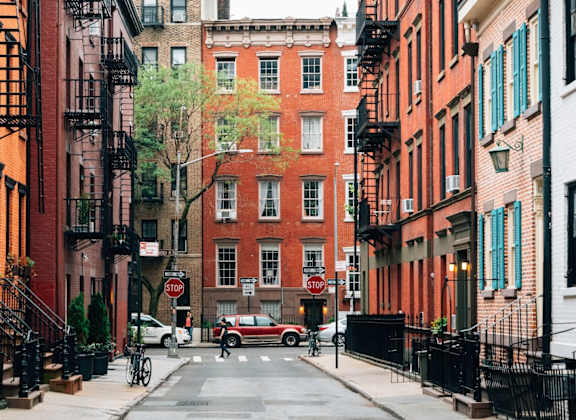 A red car is parked on the street.