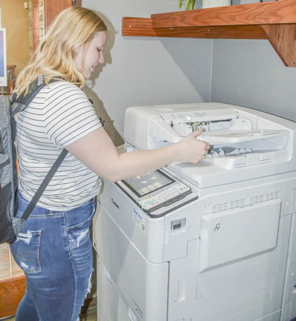 a woman is writing on a white washing machine at Boulder Ridge, Duluth Minnesota