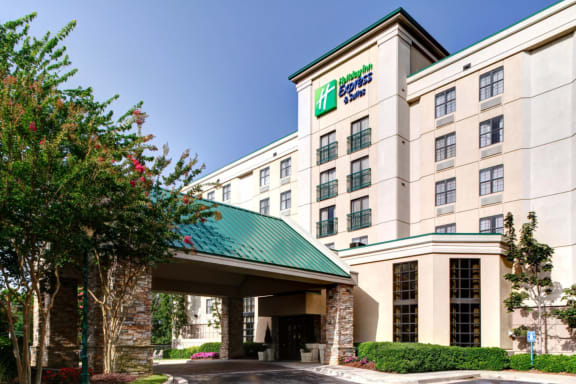 the facade of a hotel building with a green roof