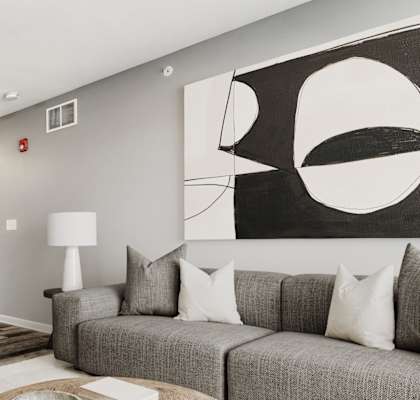 a living room with a gray couch and a wooden coffee table at Niagara Square, Buffalo, 14201