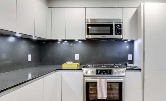 Brand new kitchen with integrated dishwasher and fridge