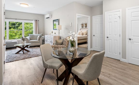 an open living room and dining room with white doors at Lofts at 335, Stratford, CT