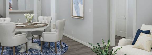 a living room and dining room with white furniture and a table