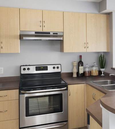 View of open concept kitchen with sink and stove