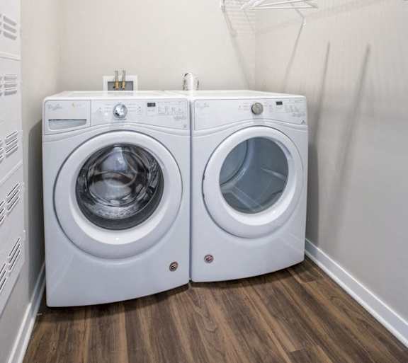 Front loading washer and dryer in a laundry room