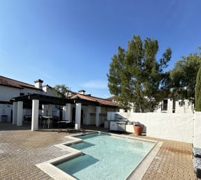 a view of a kiddie pool and sitting area at The Bryant Apartments at Yorba Linda, Yorba Linda
