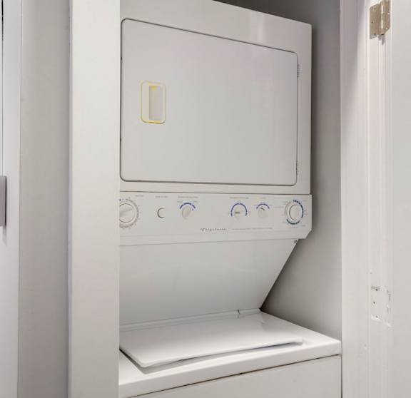 a white washer and dryer at Sleek Lofts Denver Colorado