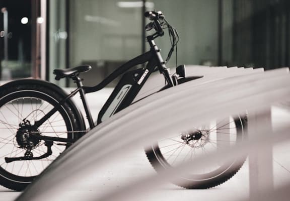 a bike parked on the side of a building