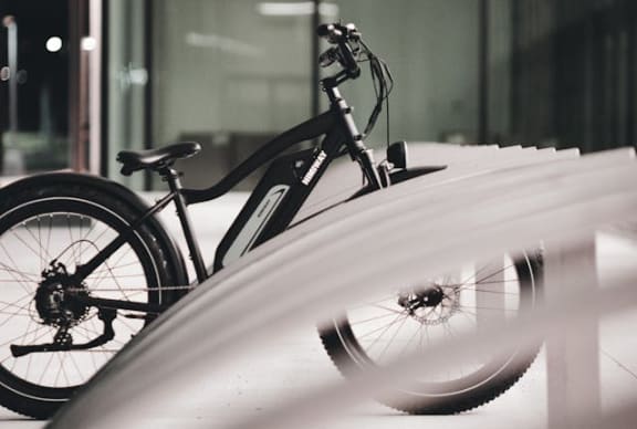 a bike parked on the side of a building