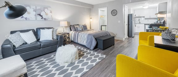a living room with a couch and a bed