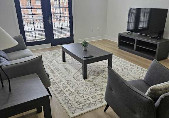 a living room with a couch and a tv