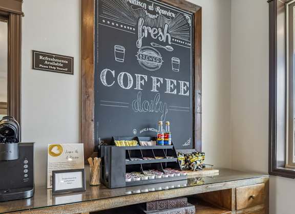 A coffee shop interior with a chalkboard sign that says