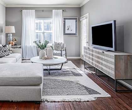 a living room with gray walls and a white ceiling