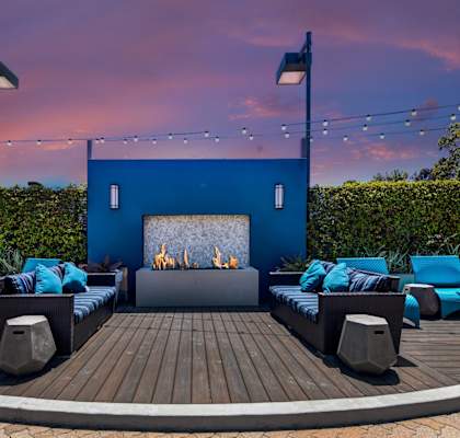 a patio with couches and chairs and a fire pit at Pointe Niguel, Laguna Niguel, CA