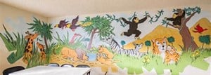 a room with a table and chairs and a mural on the wall