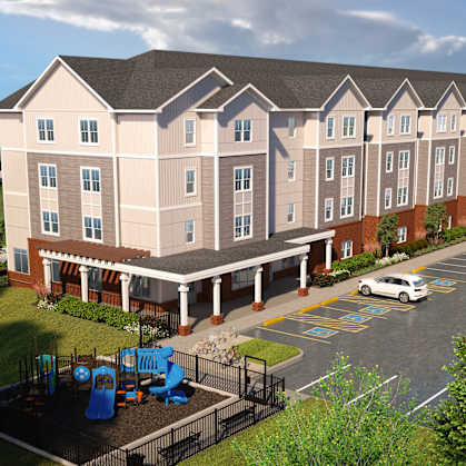 A large building with a parking lot in front of it.