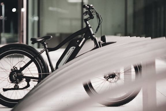 a bike parked on the side of a building