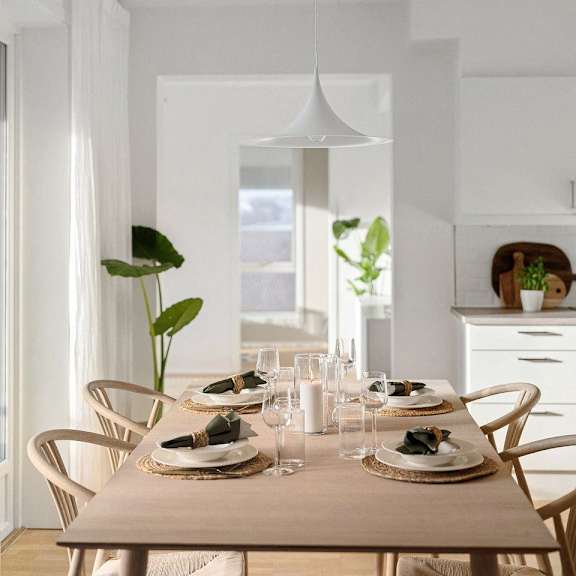 "Dining room with a wooden table and matching chairs.