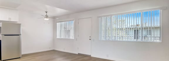 A living room with a white couch and a coffee table.