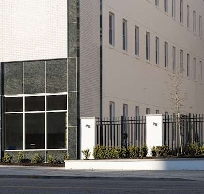 the exterior of a building in front of a parking lot