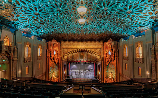 A large auditorium with a stage and seating area.