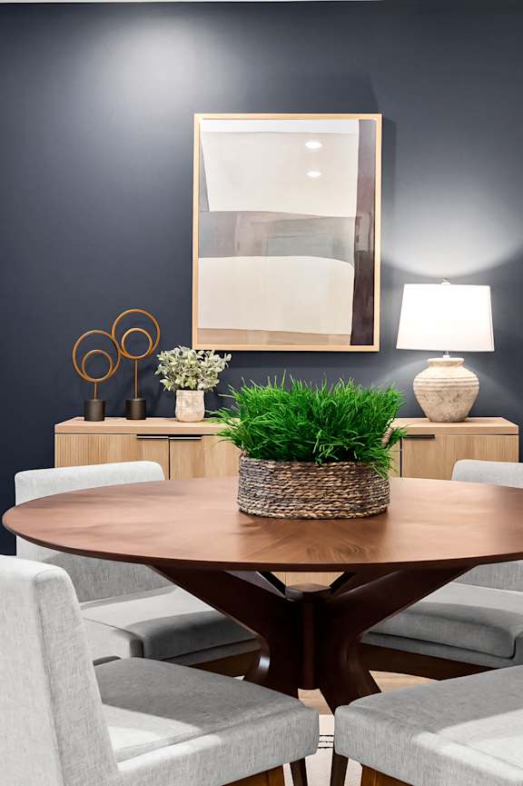 a dining room with a table and chairs