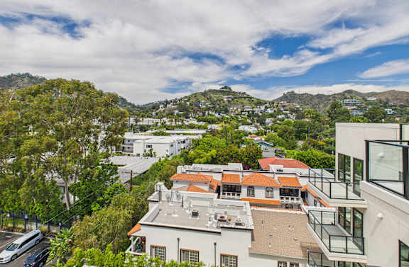 A view of a residential area with houses and trees at Skyview Sunset Apartments, Los Angeles, California