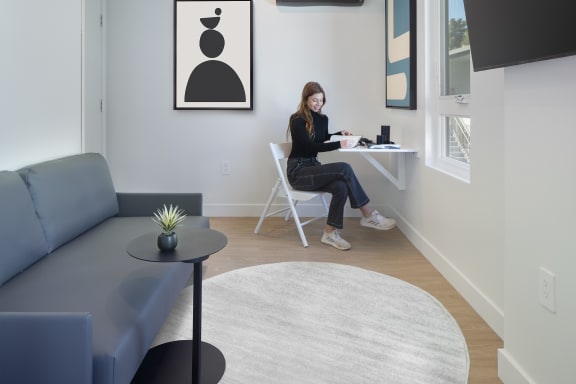 West-LA-apartments-NMS-Olive-Unit-5-Suite-A-Lifestyle-Brunette-Woman-at-Desk