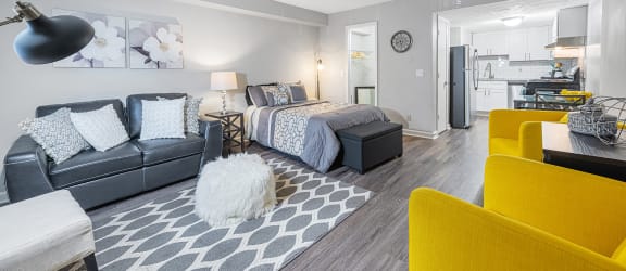 a living room with a couch and a bed