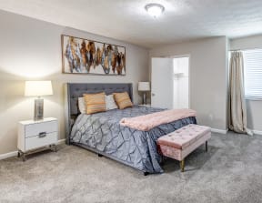 a bedroom with a bed and a and a window