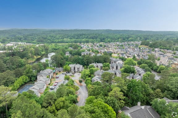 an aerial view of a neighborhood with houses and trees