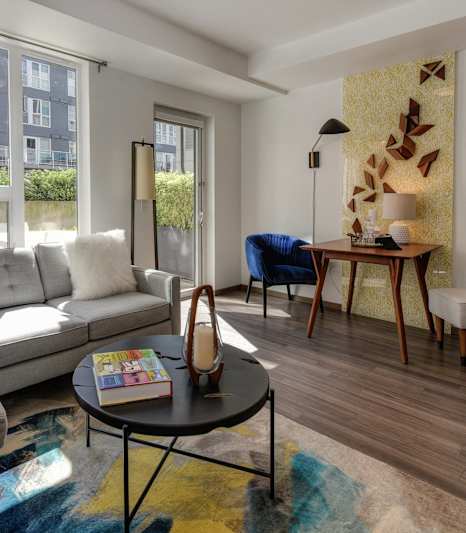 a living room with blue walls and a sliding glass door