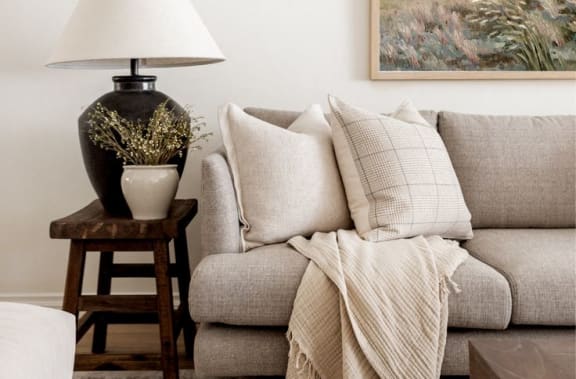 a living room with a couch and a lamp at Balfour 296 in Lilburn, 30047