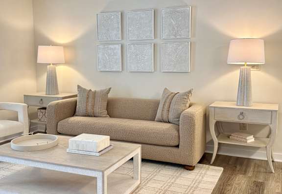 a living room with a couch and a ceiling fanat The Pointe Apartment Homes, Gautier, MS