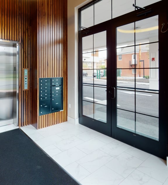 a hallway with glass doors and a door to the street