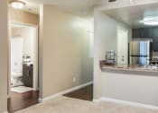 Thumbnail 5 of 27 - Living room and a kitchen with a ceiling fan at Ascend2300, 92008