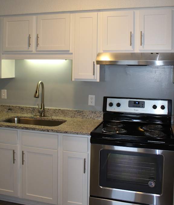 Kitchen with gooseneck faucet and undermount sink at The Avery at Auburn Apartments in Auburn, AL