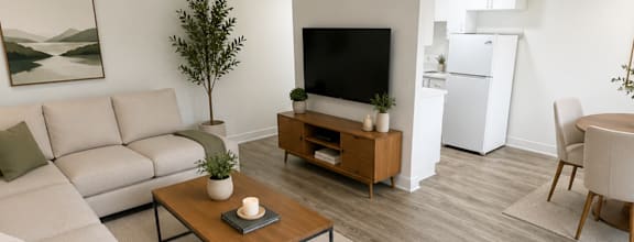 A modern dining room with a wooden table and chairs.