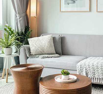 a living room with a couch and a coffee table at Conway Court Apartments in Roslindale, Massachusetts