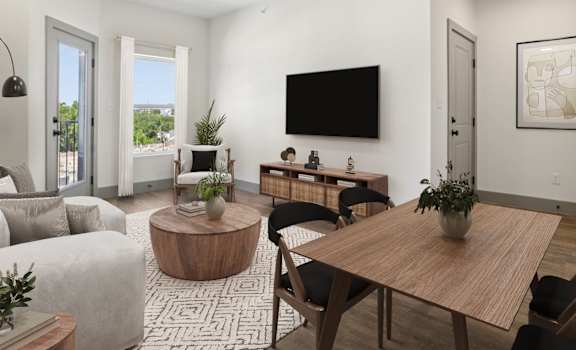 A modern living room with a wooden table and chairs.