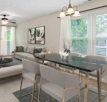 A dining room with a black table and chairs. at Hunter's Ridge Apartments, Fayetteville