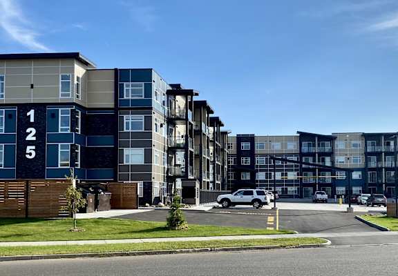 a view of an apartment building from the street