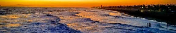 a view of the beach at sunset