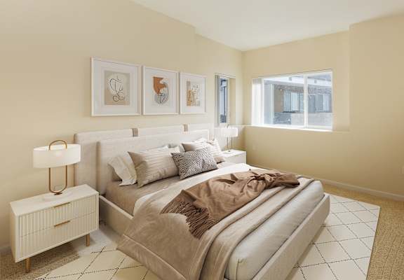 a bedroom with a large bed and a window