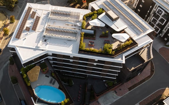 a swimming pool on the top of a building